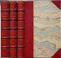 Three hand-gilded half leather books, with raised frets; marbled paper cover