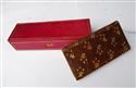 Hand-gilded stamp case made of red leather; hand-gilded photo case made of brown leather